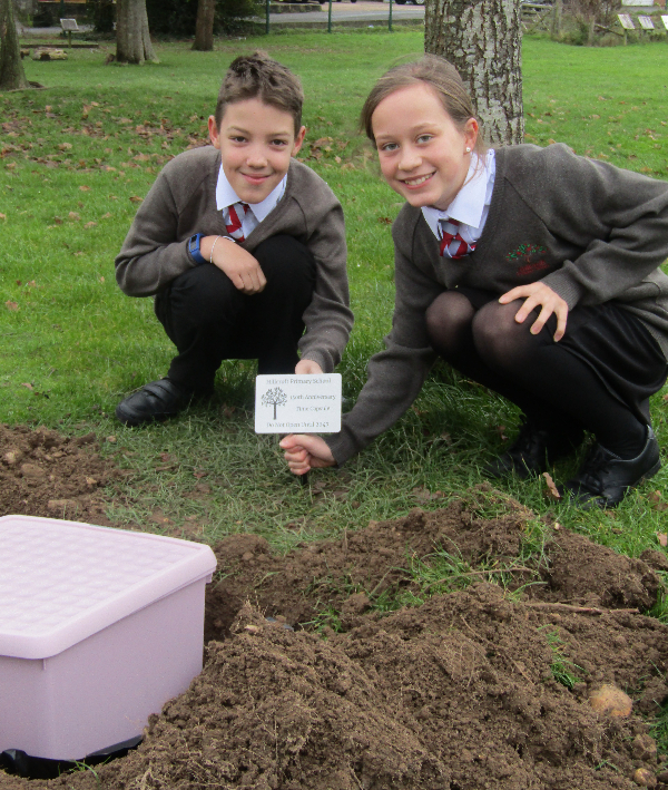 James and Tabitha with the time capsule's commemoration plaque