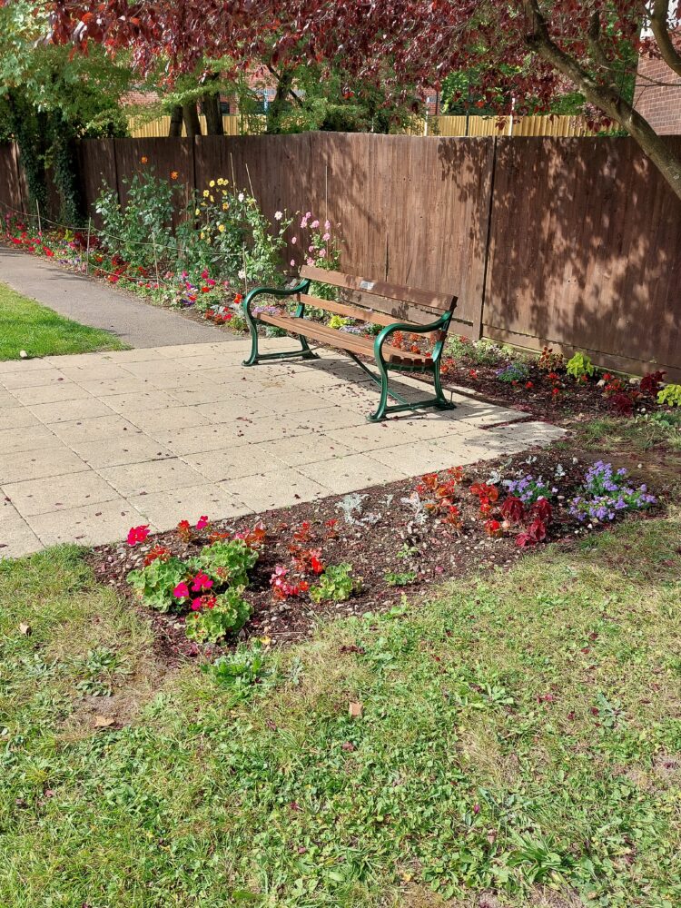 The new benches and flowers in Whyteleafe's community garden