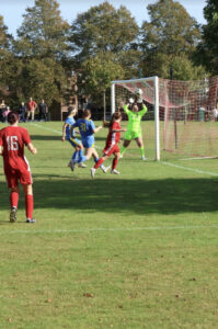 Oxted Womens FC player Codie Roy scores against Reigate