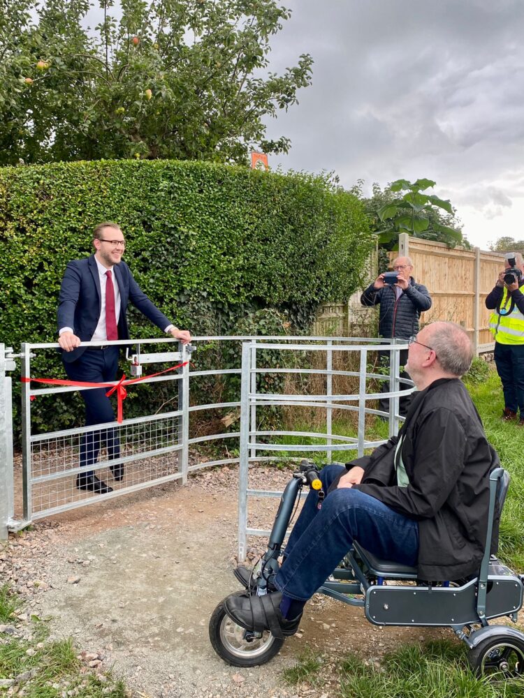 Cllr Cameron McIntosh at the opening of the new gates on the Oxted to Limpsfield footpath