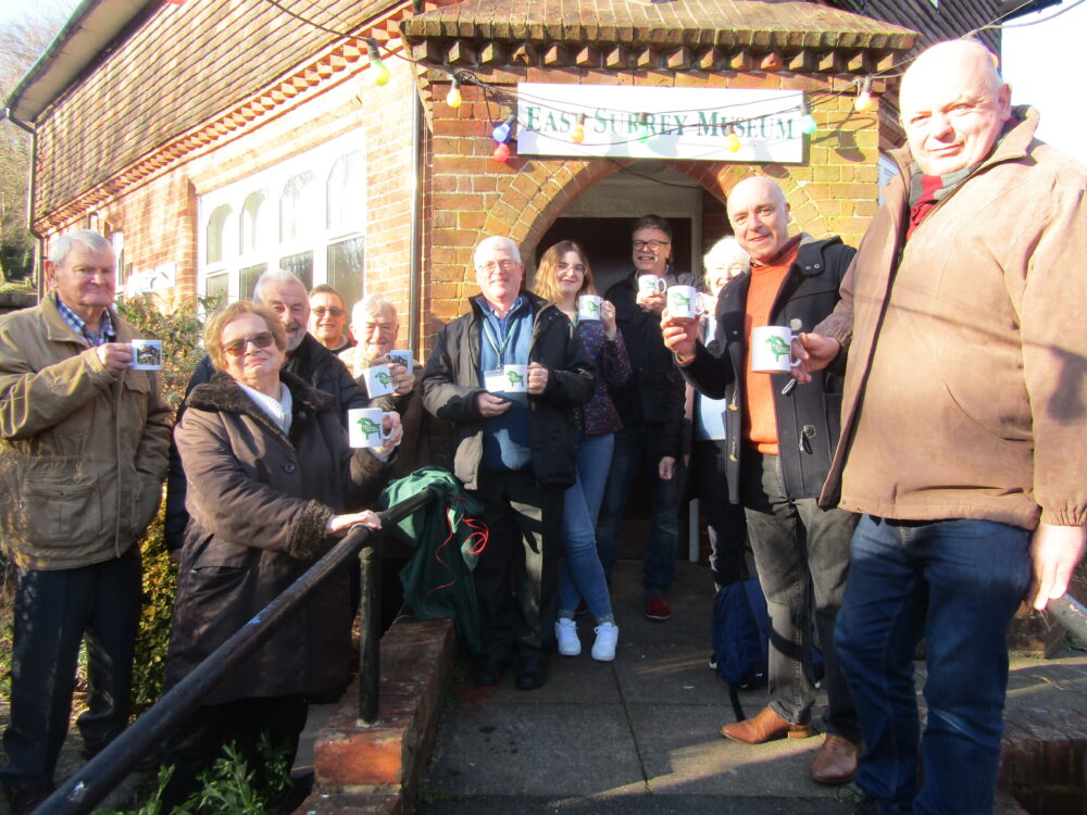 The volunteers and Friends of East Surrey Museum celebrate the new sign