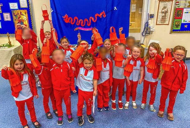 A group of Rainbows holding red paper Chinese lanters